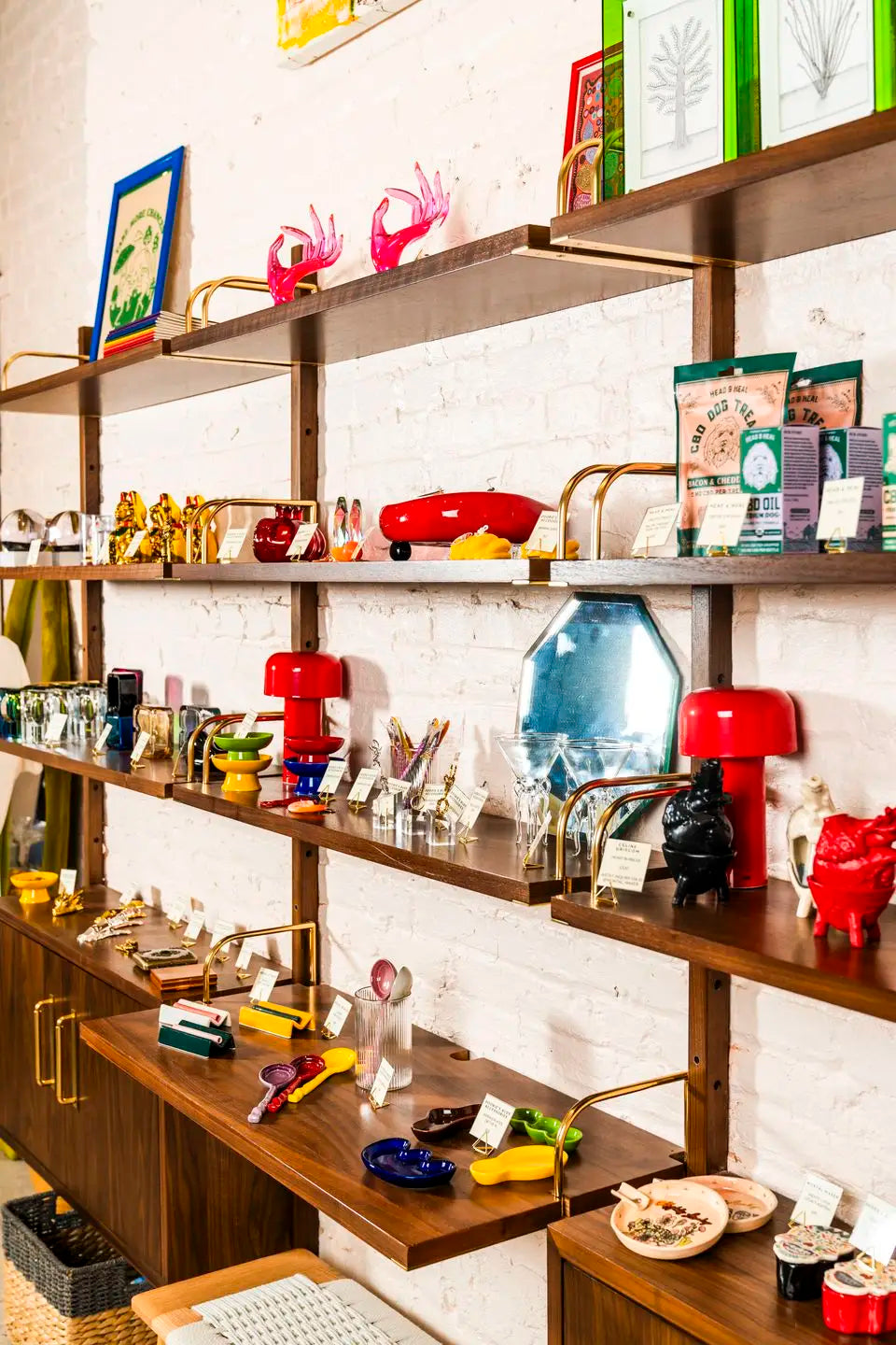 Cannabis dispensary interior near Little Italy NYC with curated product display shelves